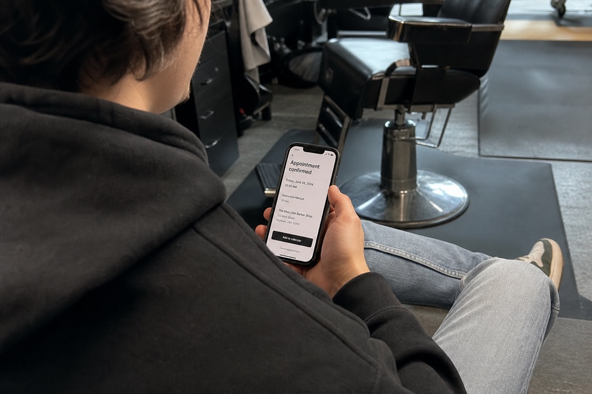 A salon client confirming an appointment on their phone
